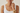 make a faceless model and the only visible is her jaw up until bust and the model is wearing a gold earings, necklace and a watch and bracelet and the model is just wearing simple sando top